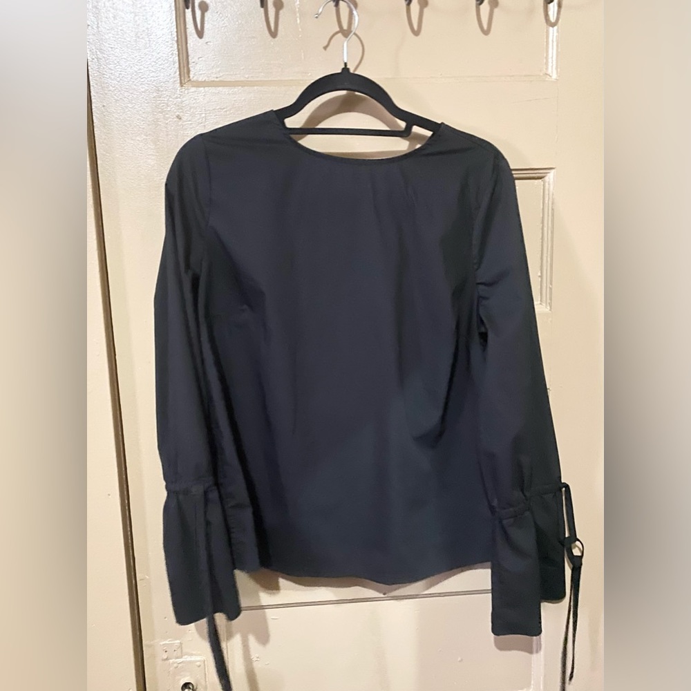 NWOT black bell sleeve blouse. Size M.
